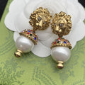 GUCCI GG LION HEAD PEARL COLORED DIAMOND EARRINGS